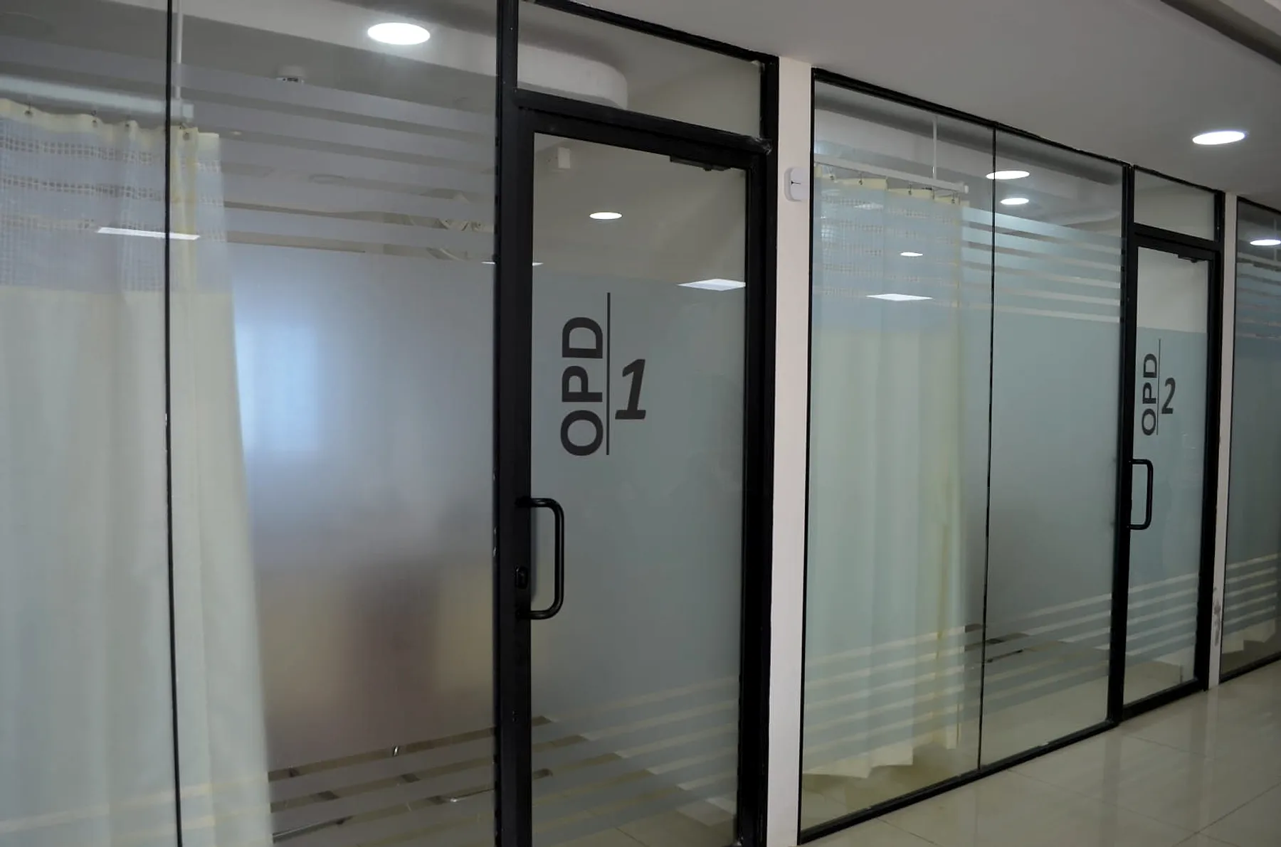 Glass-fronted OPD consultation rooms